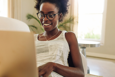 woman smiling on computer